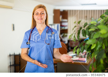Female doctor assistant standing in medical office 95548475