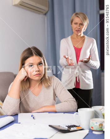 Mother scolds her adult daughter Mother scolds her adult daughter 95548765