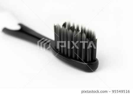 Black Toothbrush isolate on white background, close up shot Black Toothbrush isolate on white background, close up shot 95549516