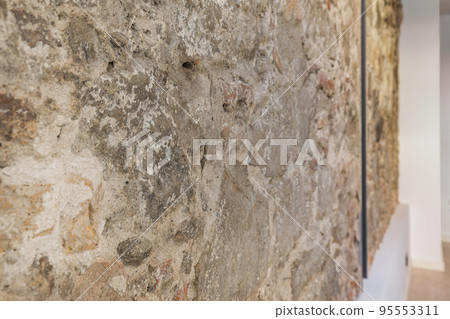 Fragment of old stone wall. Old medieval castle stone wall. Selective focus Fragment of old stone wall. Old medieval castle stone wall. Selective focus 95553311