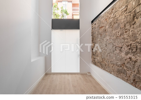 Refurbished apartment with restored ancient wall left from old city buildings. Refurbished apartment with restored ancient wall left from old city buildings. 95553315