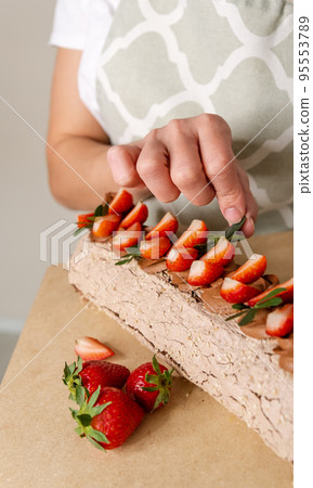 Cake roll with strawberries and cream cheese. Pie with cream 95553789
