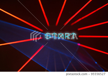 Dark background with red laser beams and text Start. Dark background with red laser beams and text Start. 95556527