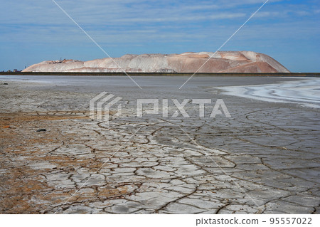 Potash waste heaps with toxic lake and dried up earth 95557022