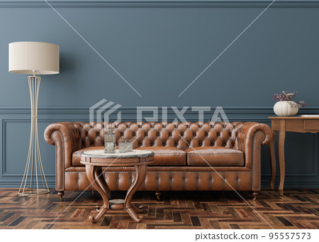 Empty blue wall in modern living room. Mock up interior in classic style. Copy space for your picture, poster. Template for artwork. Brown leather sofa, parquet floor, wall molding. 3D rendering. Empty blue wall in modern living room. Mock up interior in classic style. Copy space for your picture, poster. Template for artwork. Brown leather sofa, parquet floor, wall molding. 3D rendering. 95557573