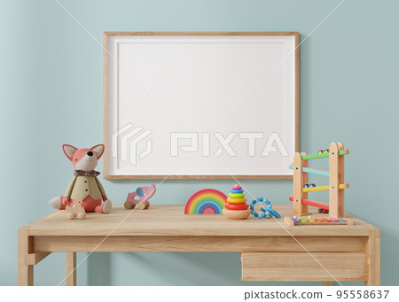 Empty horizontal picture frame hanging on blue wall in modern child room. Frame mock up in contemporary style. Free, copy space for picture, poster. Plush and wooden toys. Close up view. 3D rendering. 95558637