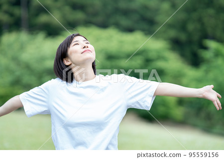 A woman refreshing with fresh green A woman refreshing with fresh green 95559156
