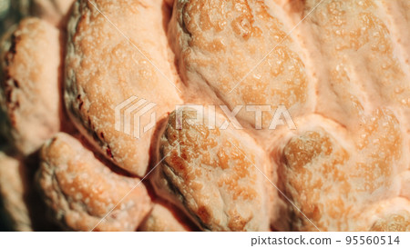 Abstract mystic background beauty nature wallpaper. Real photo close macro sugar custard apple annona exotic tropical fruit. Oval scaly skin texture surface rough. Light yellow brown contrast color Abstract mystic background beauty nature wallpaper. Real photo close macro sugar custard apple annona exotic tropical fruit. Oval scaly skin texture surface rough. Light yellow brown contrast color 95560514