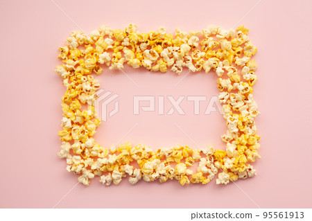 Food. Frozen Popcorn Corn Delicious Yellow Popcorn on Pink Background. Cinema. Copyspace. Place for Text. Food. Frozen Popcorn Corn Delicious Yellow Popcorn on Pink Background. Cinema. Copyspace. Place for Text. 95561913