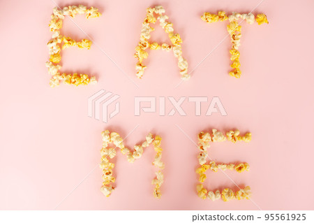 Food. Frozen Popcorn Corn Popcorn bucket. Delicious Popcorn on Pink Background. Cinema. Food. Frozen Popcorn Corn Popcorn bucket. Delicious Popcorn on Pink Background. Cinema. 95561925