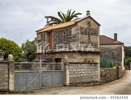 Beautiful village of Vigo in Spain, unique for its horreos, traditional granary barns 95562439