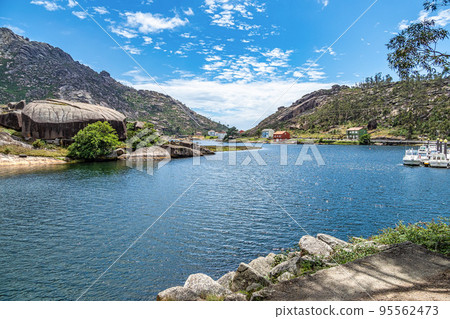 beautiful landscape of the coast of Ezaro Galicia in Spain, granite mountain, small town and beautiful beach 95562473