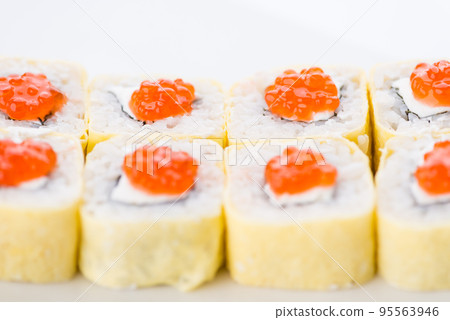 Japanese food restaurant, sushi maki gunkan roll plate or platter set. Sushi set and composition Japanese food restaurant, sushi maki gunkan roll plate or platter set. Sushi set and composition 95563946