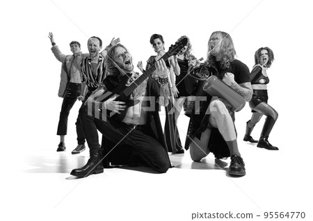 Group of emotive, expressive people, man and woman, rock music performers posing over white background. Black and white photography. Group of emotive, expressive people, man and woman, rock music performers posing over white background. Black and white photography. 95564770