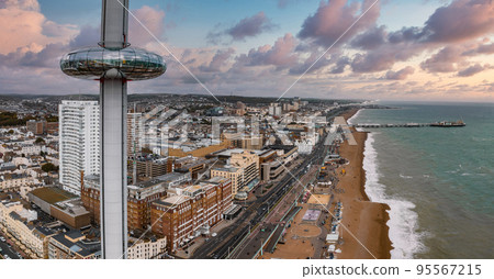 Aerial view of British Airways i360 observation deck in Brighton, UK. Beautiful tower with tourists exploring Brighton by the sea with an amazing view. Aerial view of British Airways i360 observation deck in Brighton, UK. Beautiful tower with tourists exploring Brighton by the sea with an amazing view. 95567215