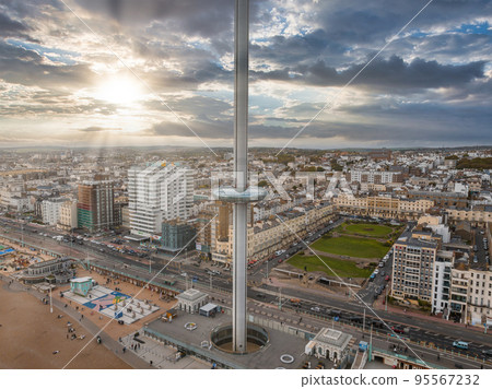 Aerial view of British Airways i360 observation deck in Brighton, UK. Beautiful tower with tourists exploring Brighton by the sea with an amazing view. Aerial view of British Airways i360 observation deck in Brighton, UK. Beautiful tower with tourists exploring Brighton by the sea with an amazing view. 95567232