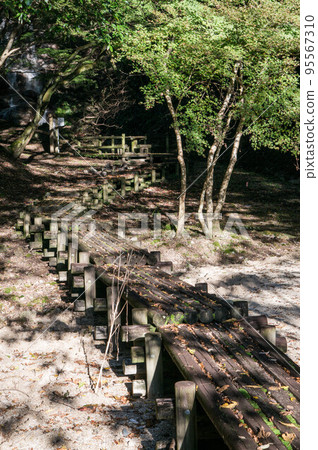 A small bridge made of wood from the Otowa River Sabo Dam in Kyoto 95567310