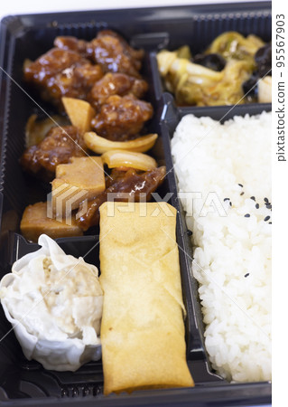 Delicious black sweet and sour pork Chinese bento 95567903