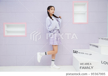 Cute portrait of young woman in sporty fashion 95567995