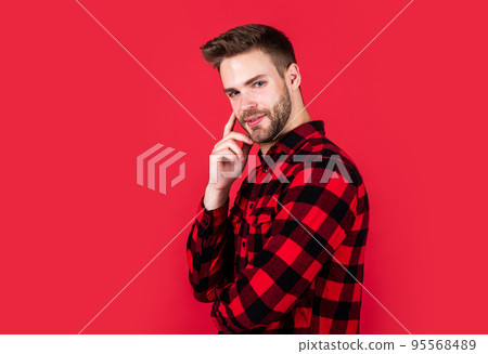Wild West is his heart. handsome casual man standing with beard and bristle. cheerful and stylish. handsome man on red background. indoor portrait of sexy european businessman. confident and calm Wild West is his heart. handsome casual man standing with beard and bristle. cheerful and stylish. handsome man on red background. indoor portrait of sexy european businessman. confident and calm 95568489