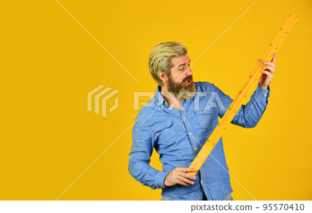 Measuring with centimeters. School education. Free education. Teaching geometry. Long or short. Bearded man use ruler. Education concept. Study hard. School classes. Measurement tool. Teacher of stem Measuring with centimeters. School education. Free education. Teaching geometry. Long or short. Bearded man use ruler. Education concept. Study hard. School classes. Measurement tool. Teacher of stem 95570410