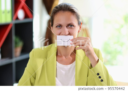 Woman covering face using white paper with good mood smile sign 95570442