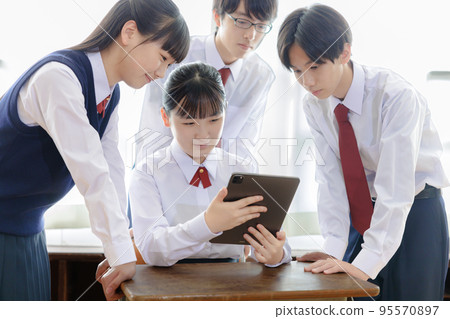 students using tablet devices 95570897