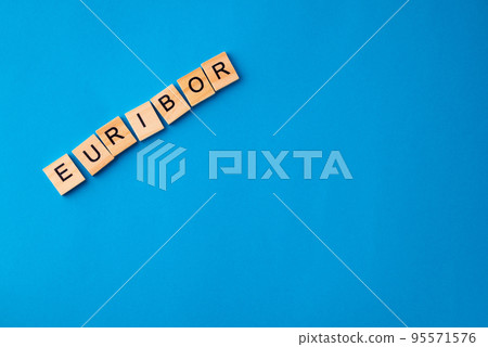 Word EURIBOR Is Written In Wooden Letters On Blue Background. Copy paste. Word EURIBOR Is Written In Wooden Letters On Blue Background. Copy paste. 95571576