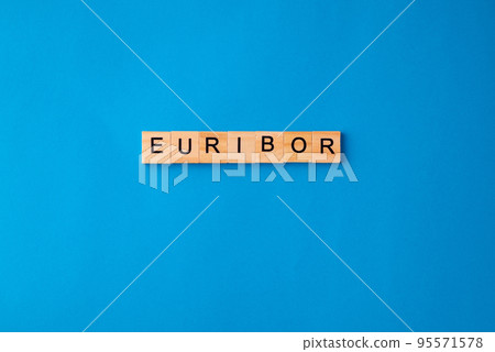 Word EURIBOR Is Written In Wooden Letters On Blue Background. Copy paste. Word EURIBOR Is Written In Wooden Letters On Blue Background. Copy paste. 95571578