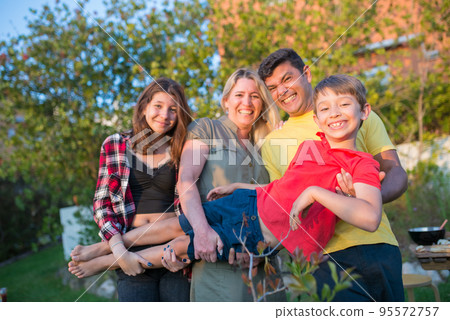 Portrait of funny family at backyard 95572757