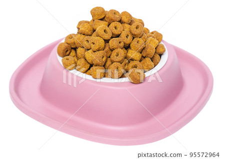 Dry food for pets. Balanced feeding for cats and dogs in a pink bowl. 95572964
