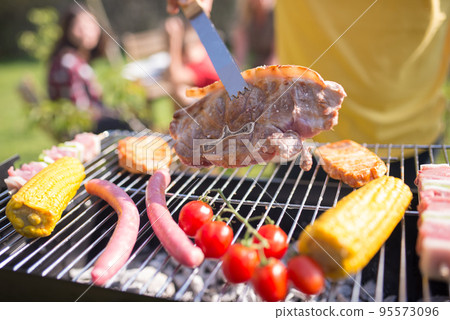 Delicious steak, sausages and fresh vegetables on BBQ Delicious steak, sausages and fresh vegetables on BBQ 95573096