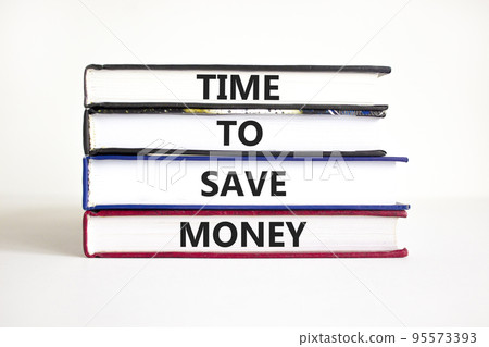Time to save money symbol. Concept words Time to save money on books on a beautiful white table white background. Business, finacial and time to save money concept. 95573393