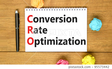 CRO conversion rate optimization symbol. Concept words CRO conversion rate optimization on white note on a beautiful wooden background. Business CRO conversion rate optimization concept. Copy space. CRO conversion rate optimization symbol. Concept words CRO conversion rate optimization on white note on a beautiful wooden background. Business CRO conversion rate optimization concept. Copy space. 95573442
