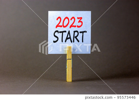 2023 Start symbol. White paper with words 2023 Start, clip on wooden clothespin. Beautiful grey table grey background. Business and 2023 start concept. Copy space. 2023 Start symbol. White paper with words 2023 Start, clip on wooden clothespin. Beautiful grey table grey background. Business and 2023 start concept. Copy space. 95573446