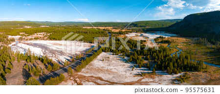 Beautiful geysers with hot water and steam with pools of thermophilic bacteria in the Upper Geyser Basin of Yellowstone National Park, Wyoming, United States. Beautiful geysers with hot water and steam with pools of thermophilic bacteria in the Upper Geyser Basin of Yellowstone National Park, Wyoming, United States. 95575631