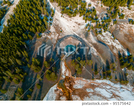 Beautiful geysers with hot water and steam with pools of thermophilic bacteria in the Upper Geyser Basin of Yellowstone National Park, Wyoming, United States. 95575642