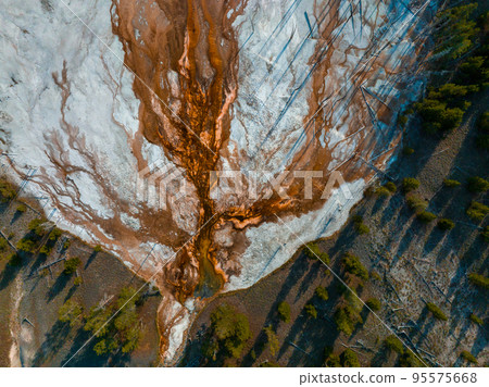 Beautiful geysers with hot water and steam with pools of thermophilic bacteria in the Upper Geyser Basin of Yellowstone National Park, Wyoming, United States. 95575668