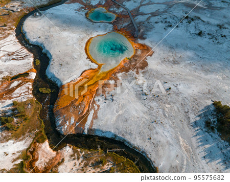 Beautiful geysers with hot water and steam with pools of thermophilic bacteria in the Upper Geyser Basin of Yellowstone National Park, Wyoming, United States. Beautiful geysers with hot water and steam with pools of thermophilic bacteria in the Upper Geyser Basin of Yellowstone National Park, Wyoming, United States. 95575682