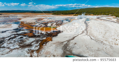 Beautiful geysers with hot water and steam with pools of thermophilic bacteria in the Upper Geyser Basin of Yellowstone National Park, Wyoming, United States. Beautiful geysers with hot water and steam with pools of thermophilic bacteria in the Upper Geyser Basin of Yellowstone National Park, Wyoming, United States. 95575683