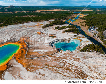 Aerial view of Grand Prismatic Spring in Midway Geyser Basin, Yellowstone National Park, Wyoming, USA. It is the largest hot spring in the United States Aerial view of Grand Prismatic Spring in Midway Geyser Basin, Yellowstone National Park, Wyoming, USA. It is the largest hot spring in the United States 95575709