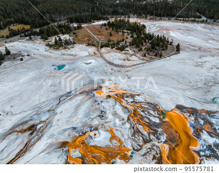 Beautiful geysers with hot water and steam with pools of thermophilic bacteria in the Upper Geyser Basin of Yellowstone National Park, Wyoming, United States. 95575781