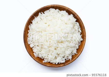 Wooden bowl of rice on white background. 95576118