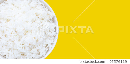 Dish of rice on yellow background. 95576119