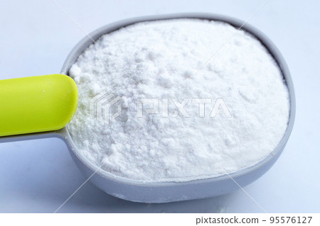 Baking soda on white background. Baking soda on white background. 95576127