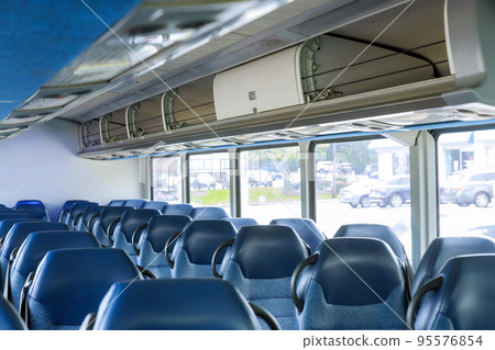 Bus interior with comfortable seats without people 95576854