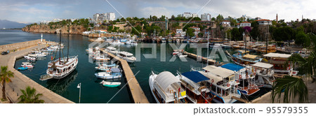 Panorama of the Antalya Old Town port with tourist ships 95579355