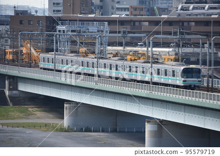 Tokyo Metro Series 9000 train (Subway Namboku Line) going over the bridge Tokyo Metro Series 9000 train (Subway Namboku Line) going over the bridge 95579719