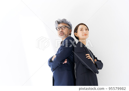 Two business people wearing suits Two business people wearing suits 95579982