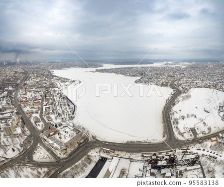 Winter view of the embankment of the city of Nizhny Tagil and the metallurgical plant from above. Environmental problem of environmental pollution and air in large cities 95583138